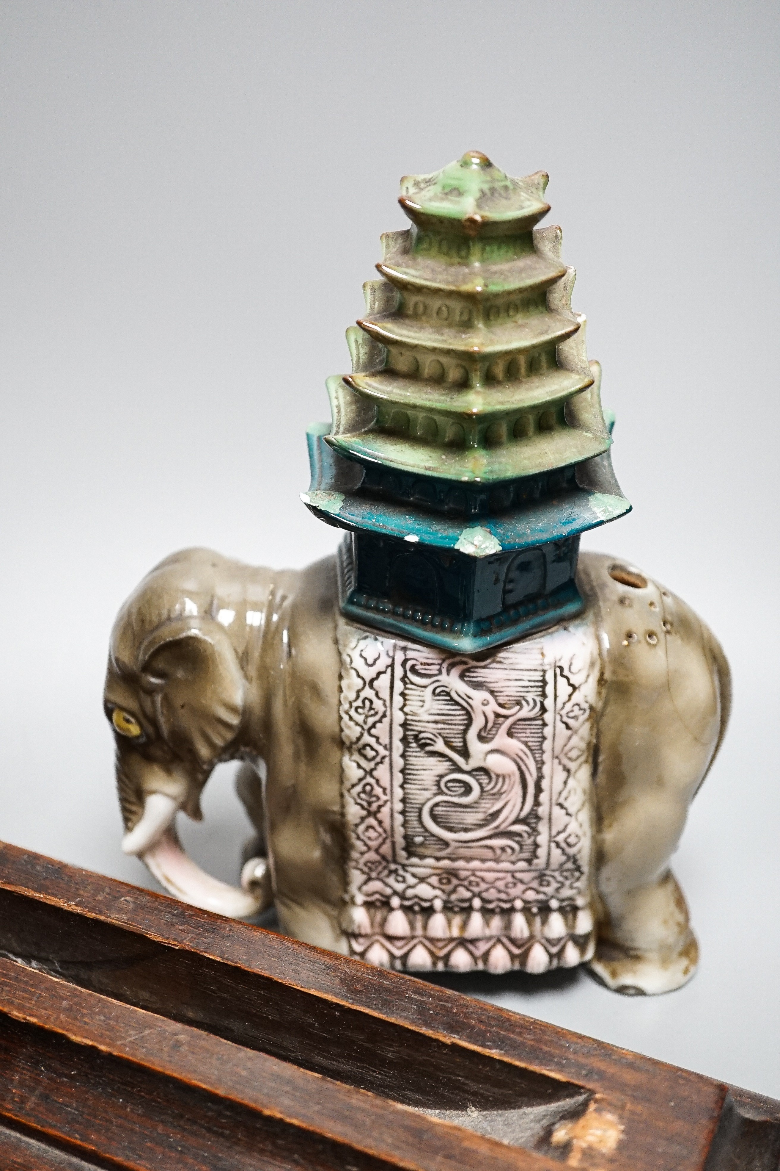 A pair of hard stone vases, 2 hard stone figural carvings, a porcelain elephant, and a quantity of hardwood stands